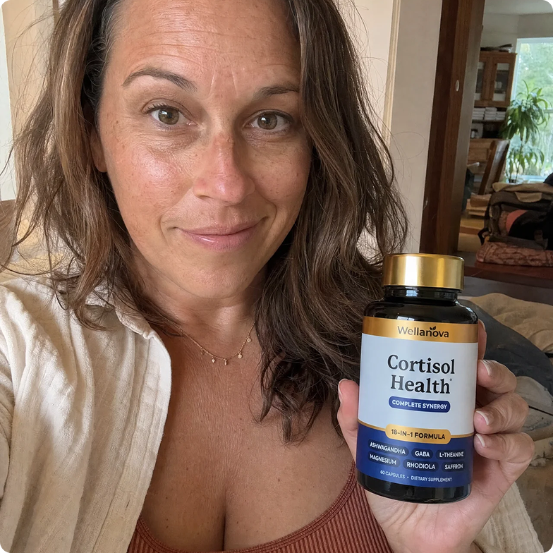 A smiling woman holds up a bottle of Wellanova Cortisol Health supplements.