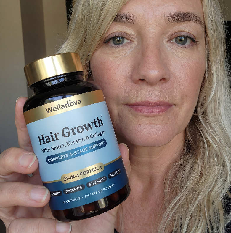A blonde woman holds up a bottle of Wellanova Hair Growth supplements to the camera.