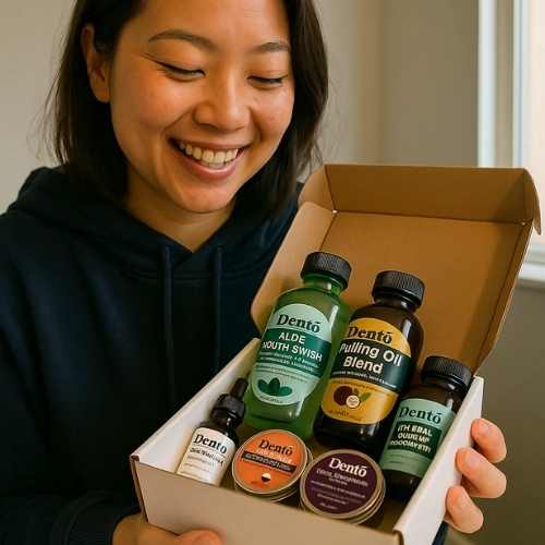 Person smiling while holding a box of dental care products.