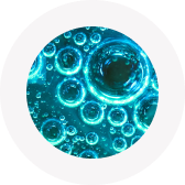 Close-up of blue bubbles in liquid, creating a circular pattern.