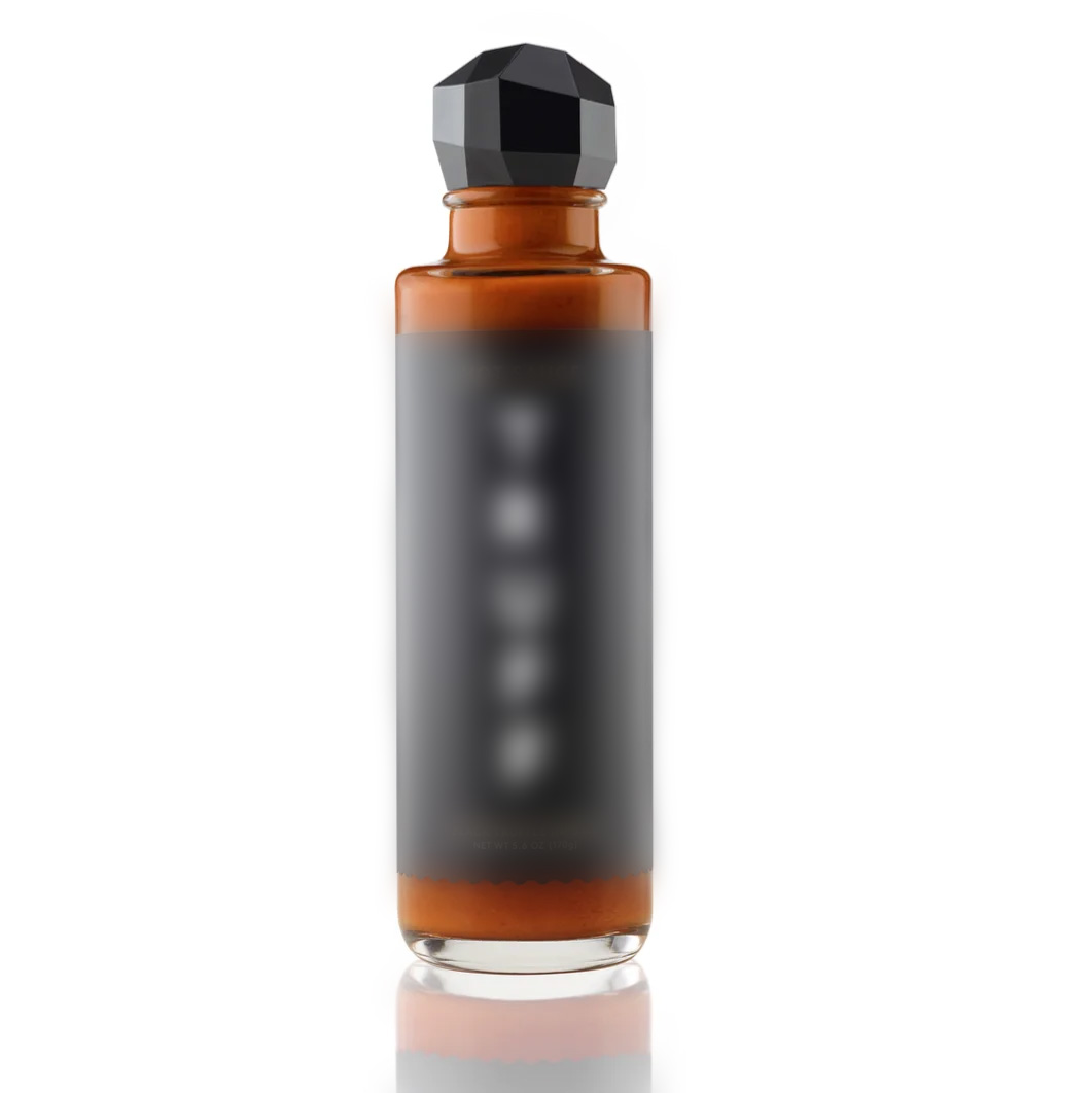A bottle of TRUFF black truffle infused hot sauce.