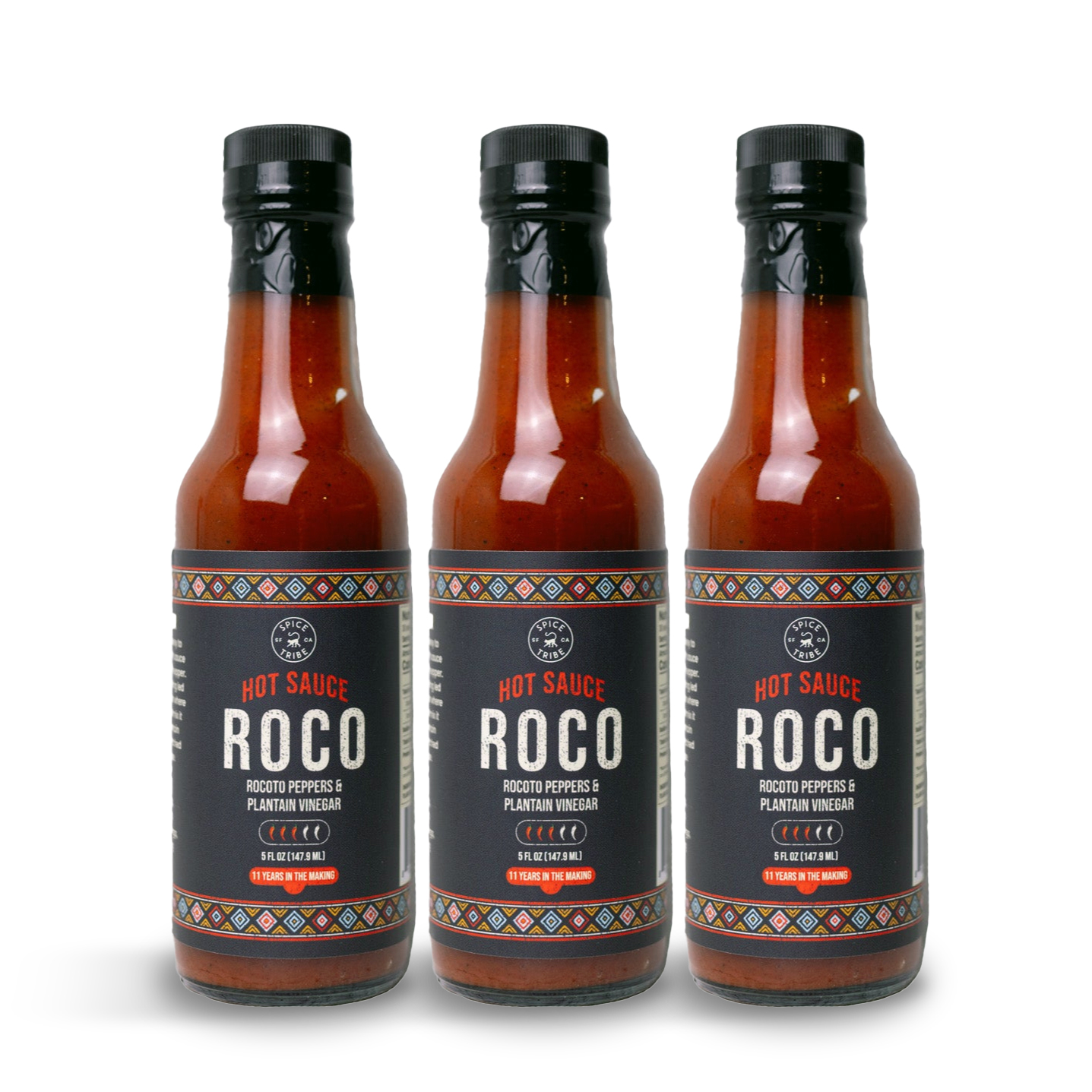 Three bottles of Roco hot sauce with colorful labels.