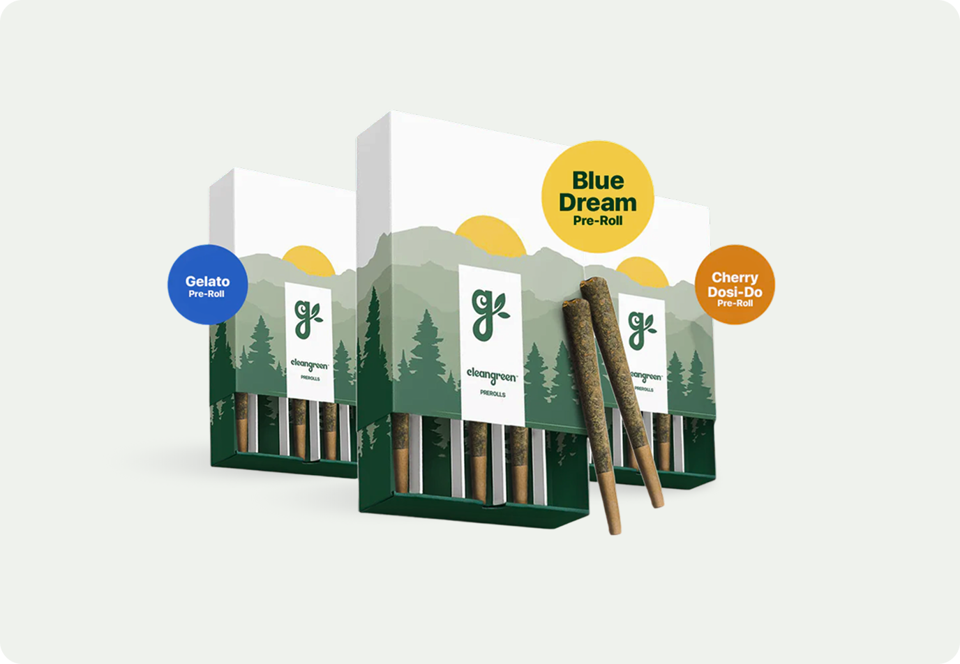 Three boxes of cleangreen pre-rolls in different flavors, with two individual pre-rolls resting against a box.