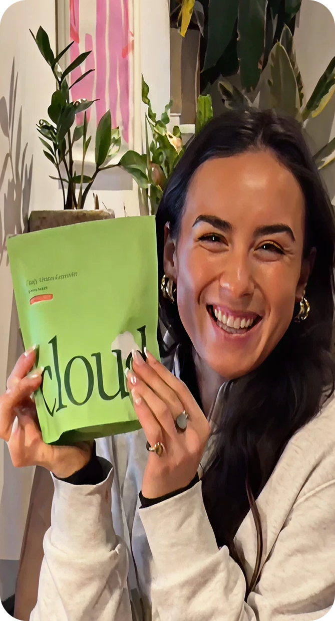 Sara holding Cloud Daily Greens Gummies
