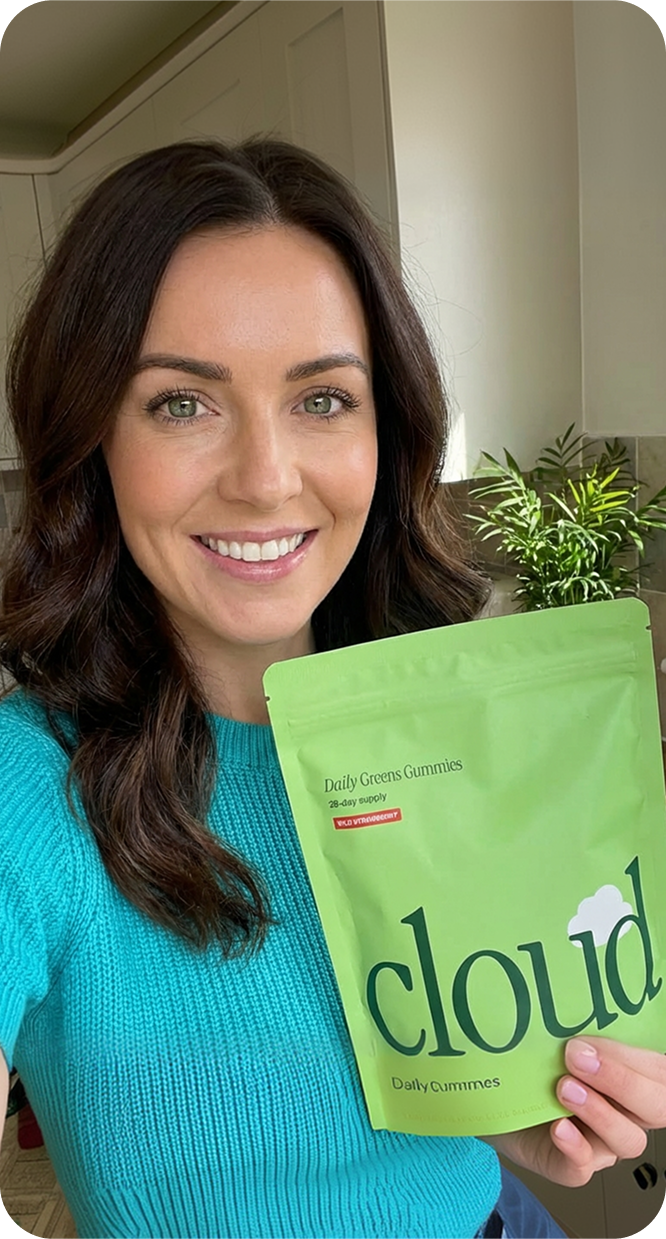 Emma holding Cloud Daily Greens Gummies