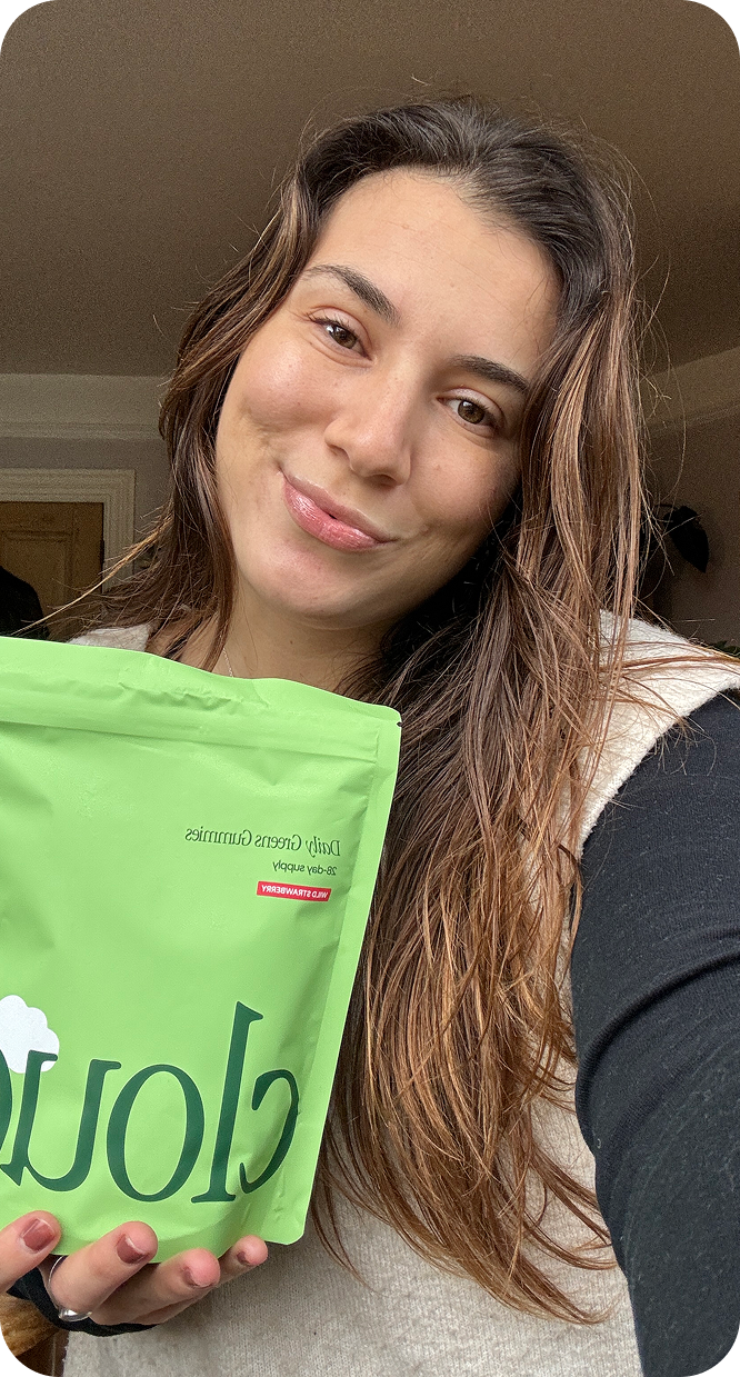 Maria holding Cloud Daily Greens Gummies