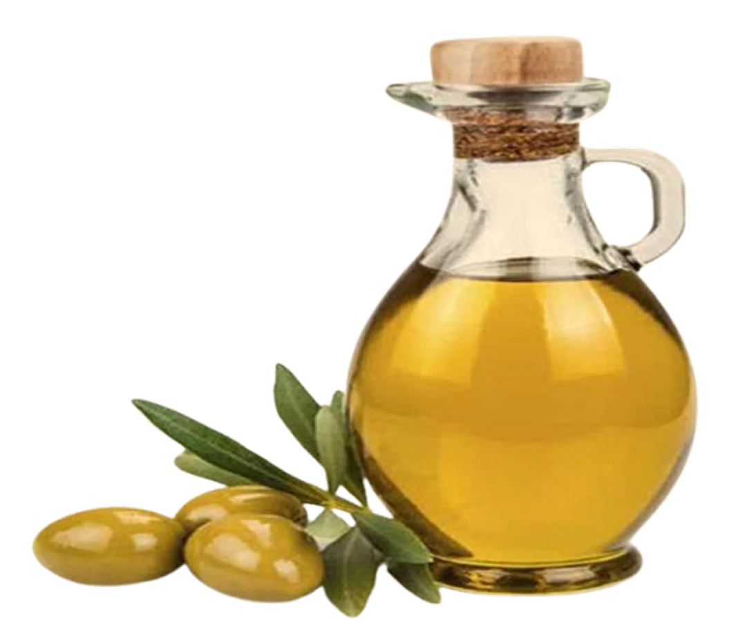 Glass bottle of olive oil with green olives and leaves.