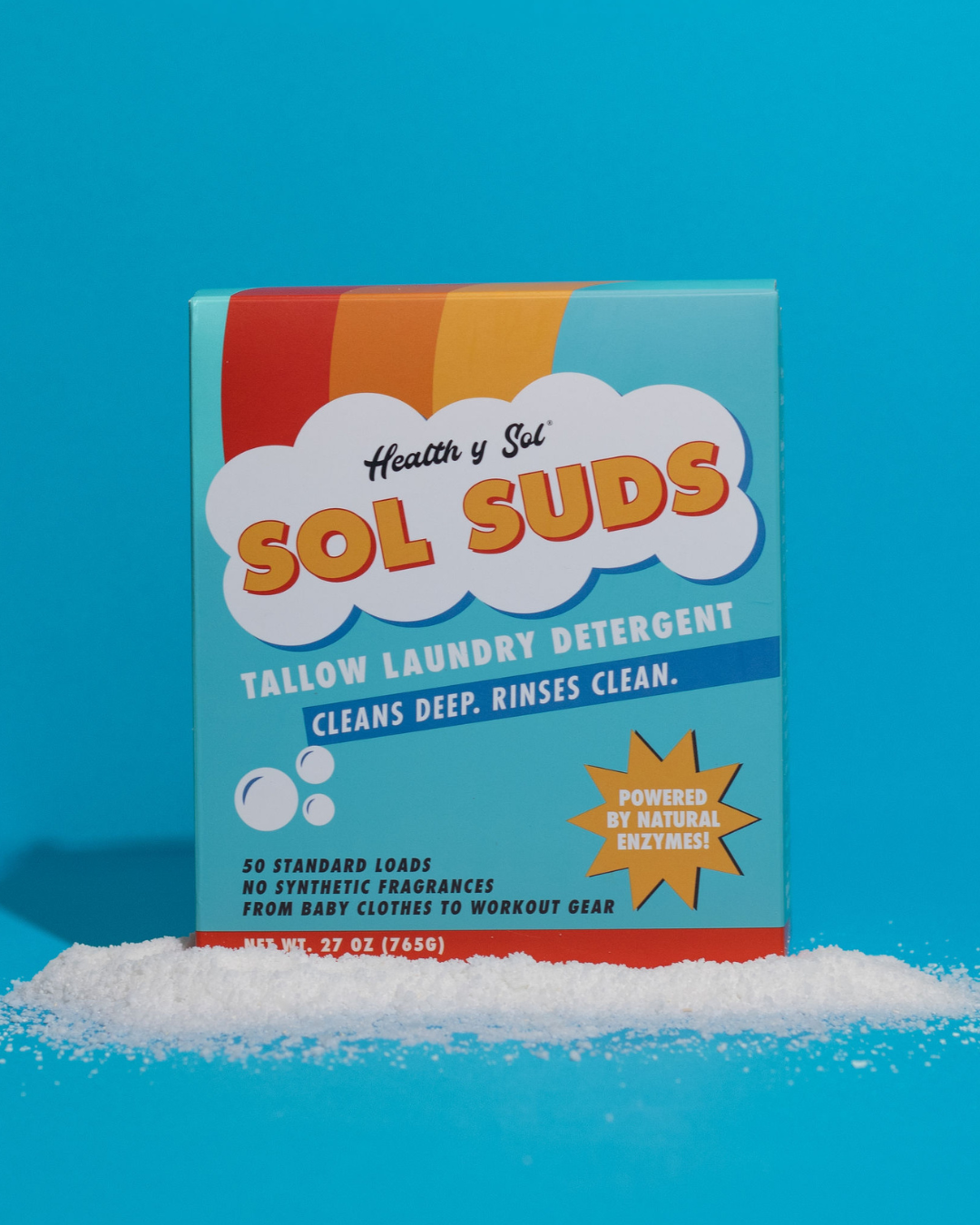 A box of Sol Suds laundry detergent shown in a triptych with two piles of the powder.