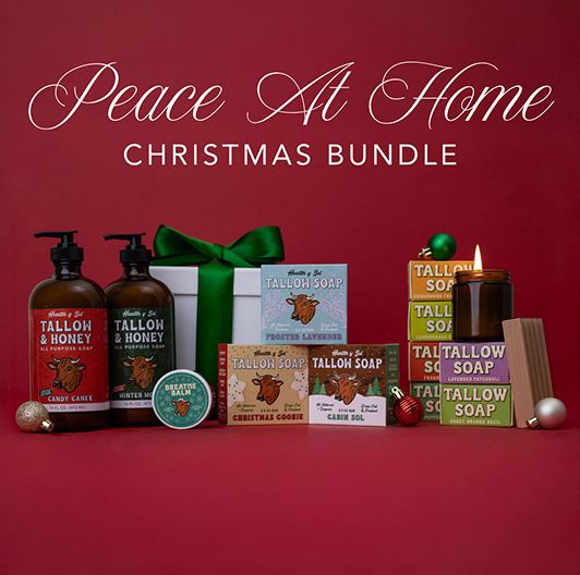 Christmas soap bundle with candles and lotion bottles on a red background.