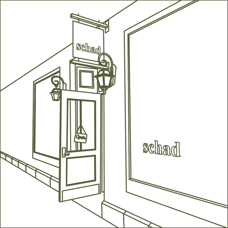 Line drawing of a storefront with an open door and word 'schad' visible.