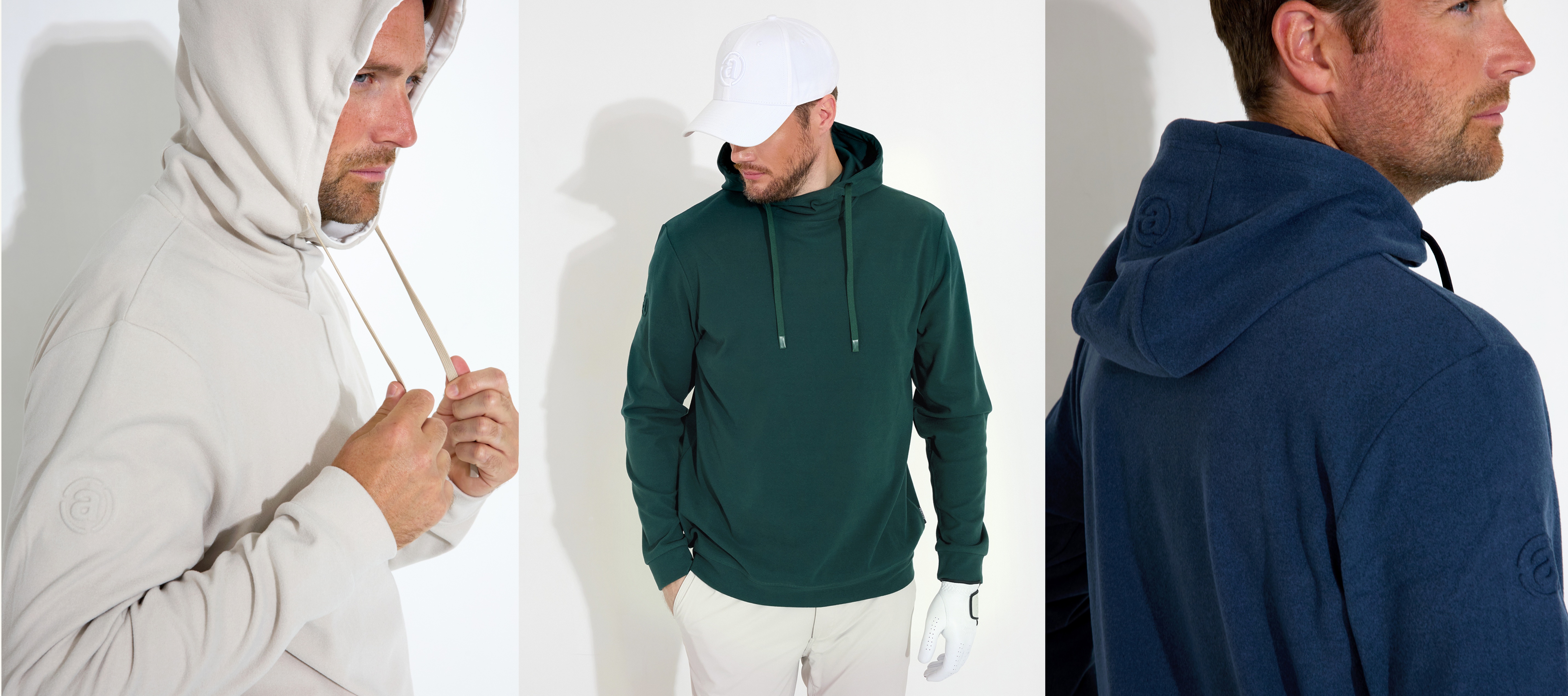A man models three hoodies in different colors: light beige, dark green, and dark blue.