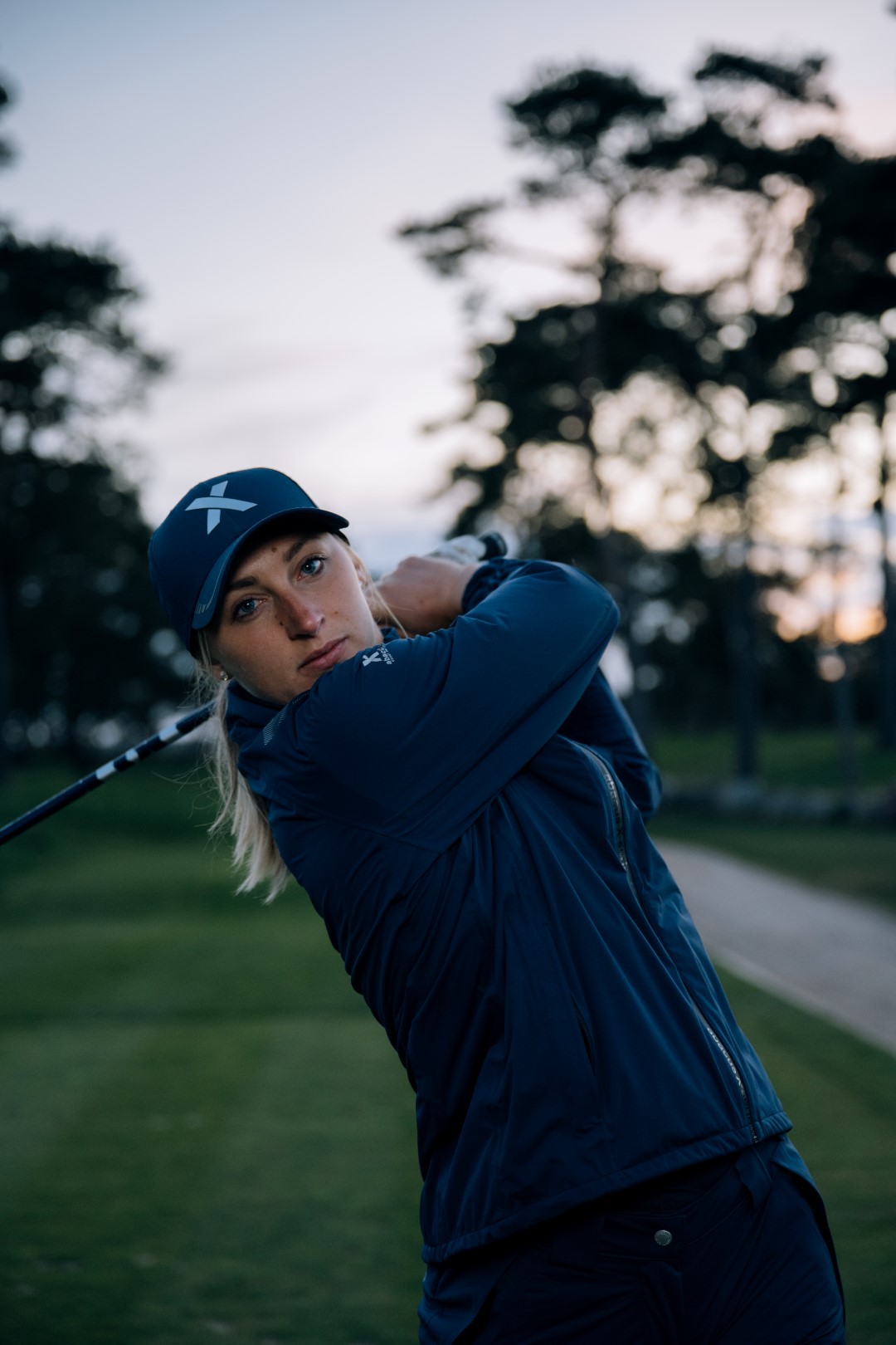 Pitch 37.5 Rain Jacket showing stretch fabric during golf swing