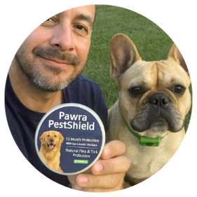 Person holding Pawra PestShield product next to a dog.