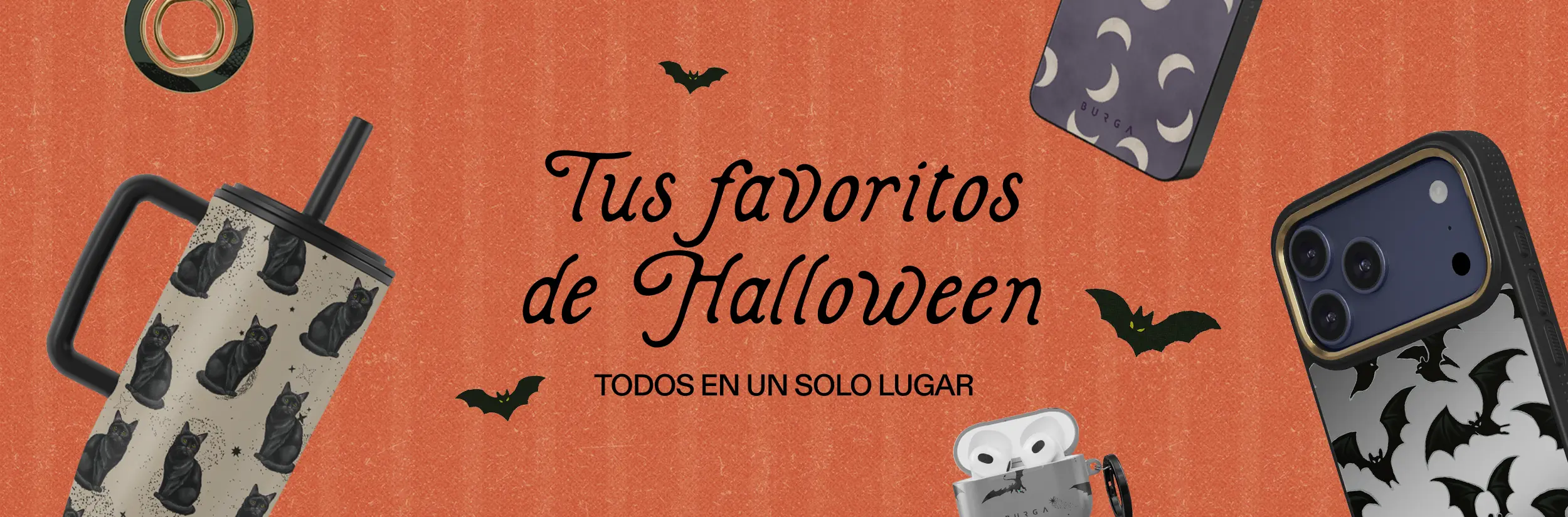A flat lay of Halloween-themed accessories including phone cases, a tumbler, and an earbuds case on an orange background.
