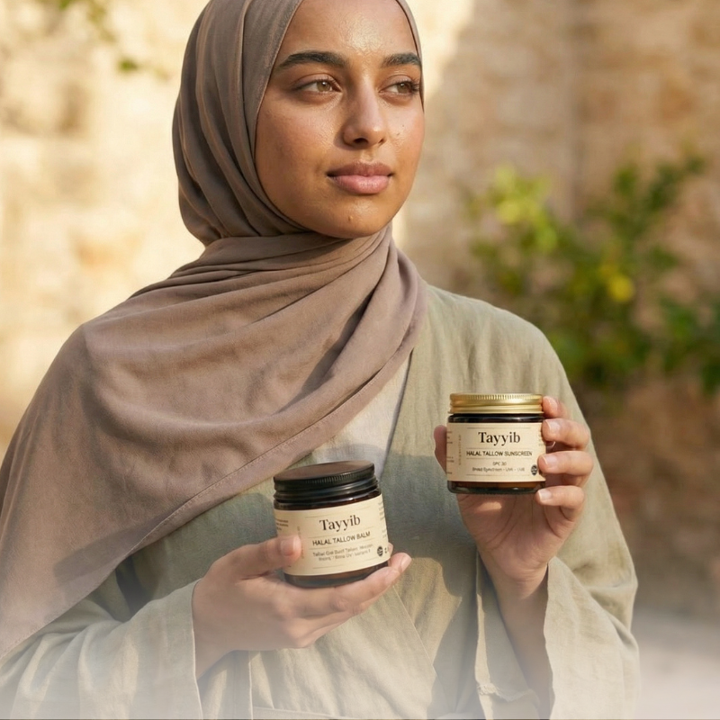 A woman in a hijab holds two jars of Tayyib brand skincare products in an outdoor setting.