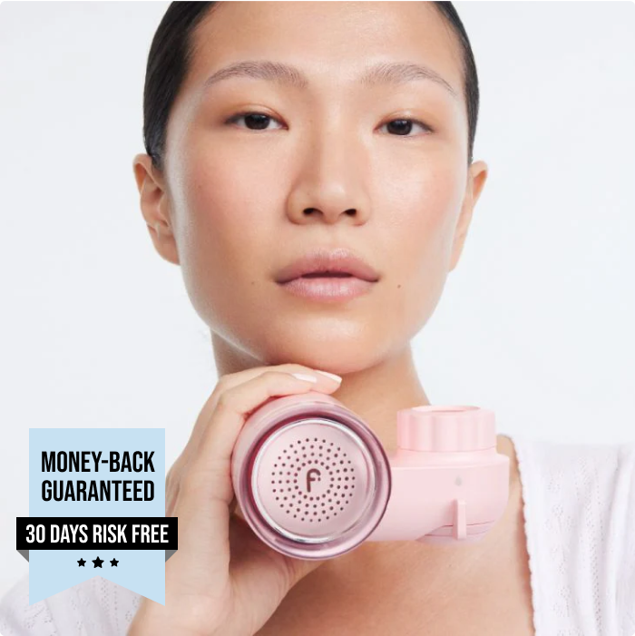 Woman holding a pink skincare gadget, featuring a money-back guarantee text.