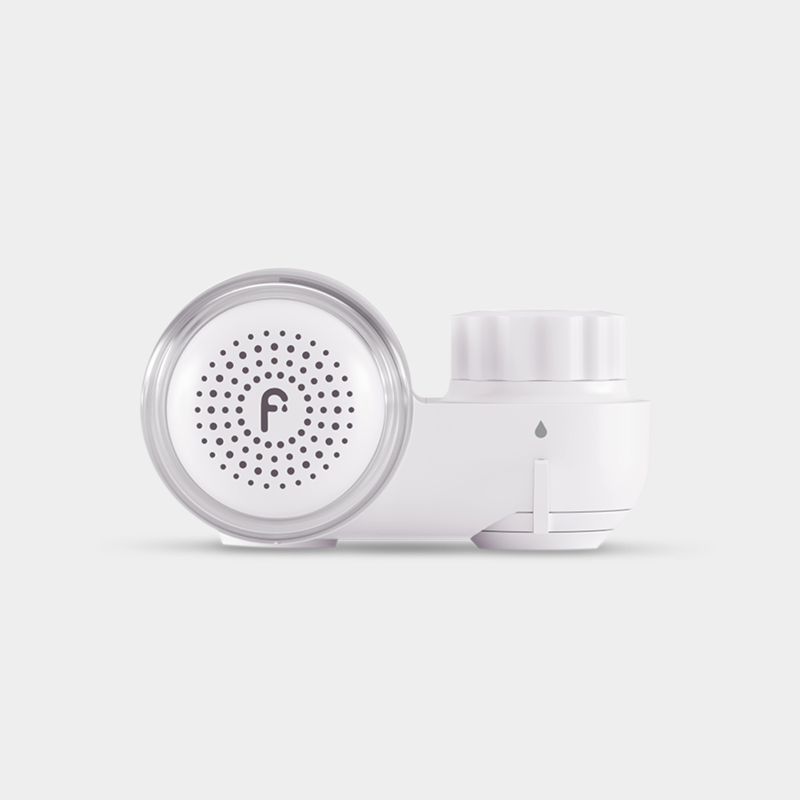 White circular device with a perforated front and a letter 'F' logo.