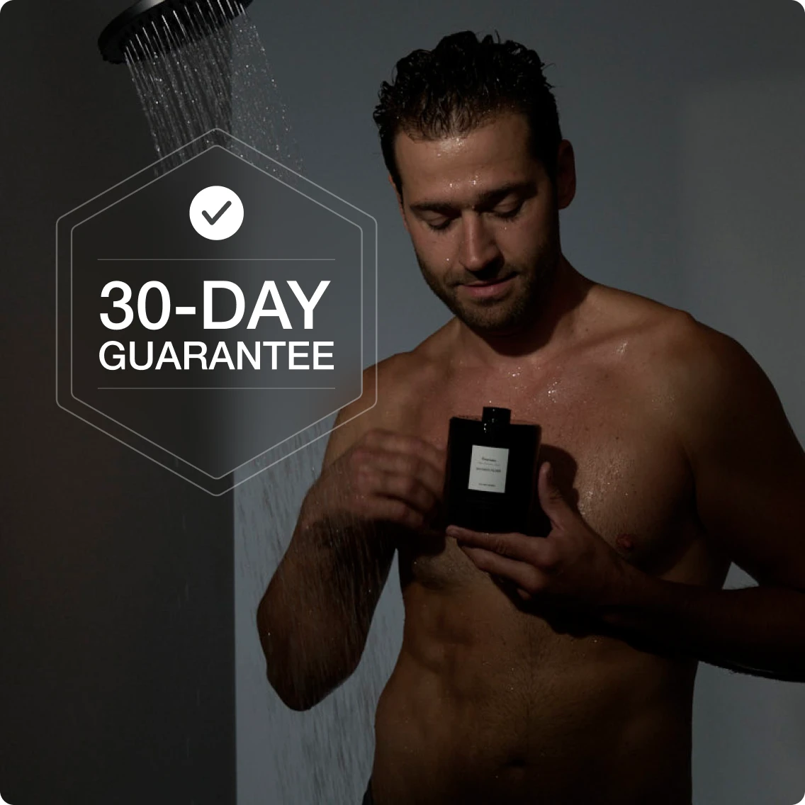 A shirtless man stands in a shower holding a black bottle, with a '30-Day Guarantee' emblem overlaid.