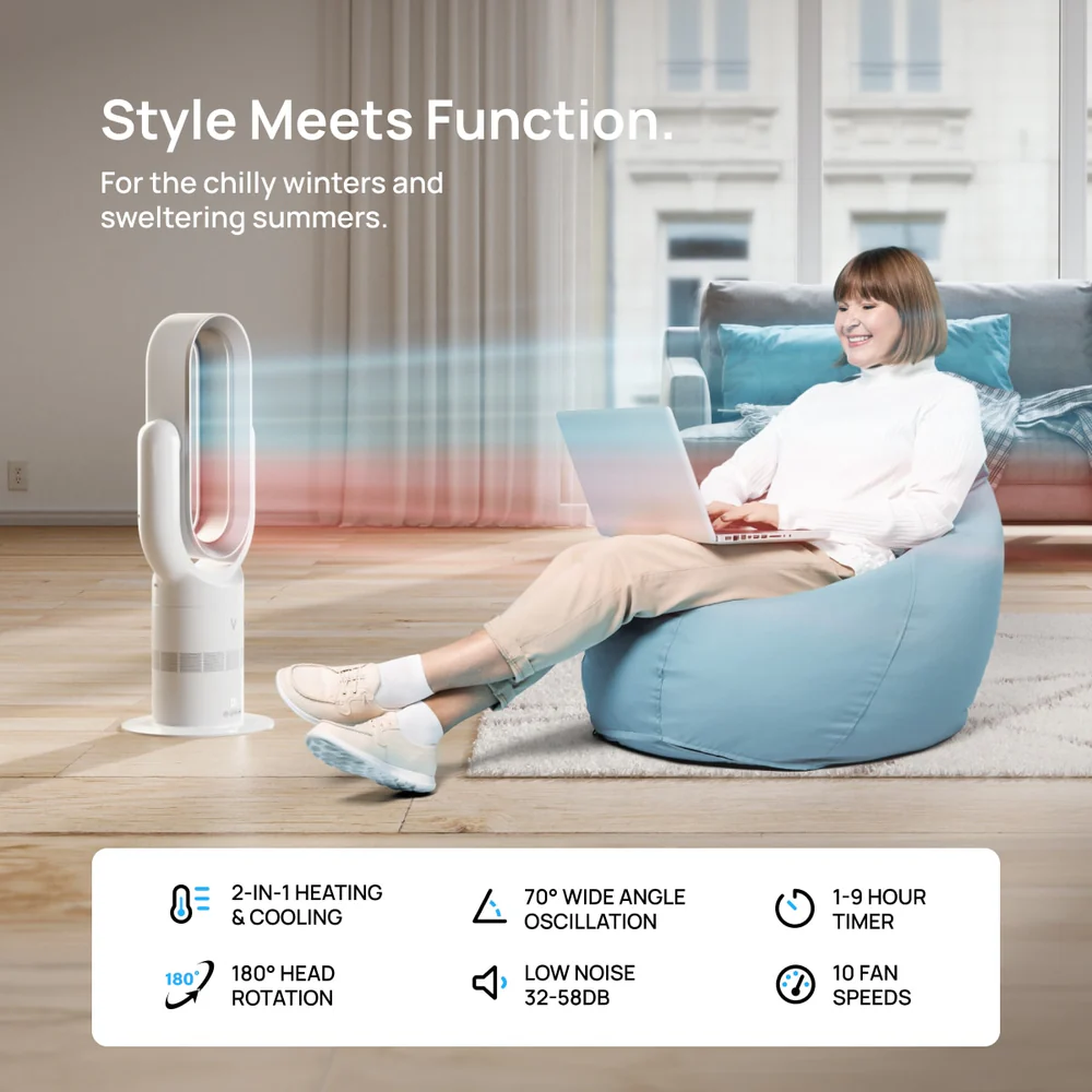 Woman sitting on a bean bag with a laptop, next to a bladeless fan.