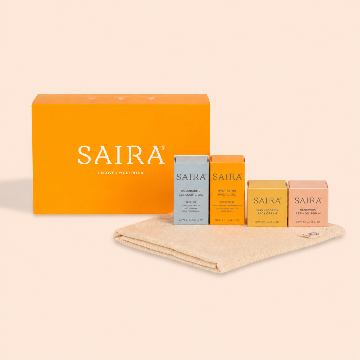 A Saira skincare set with an orange box, four smaller boxes, a cloth, a metal funnel, and an applicator.