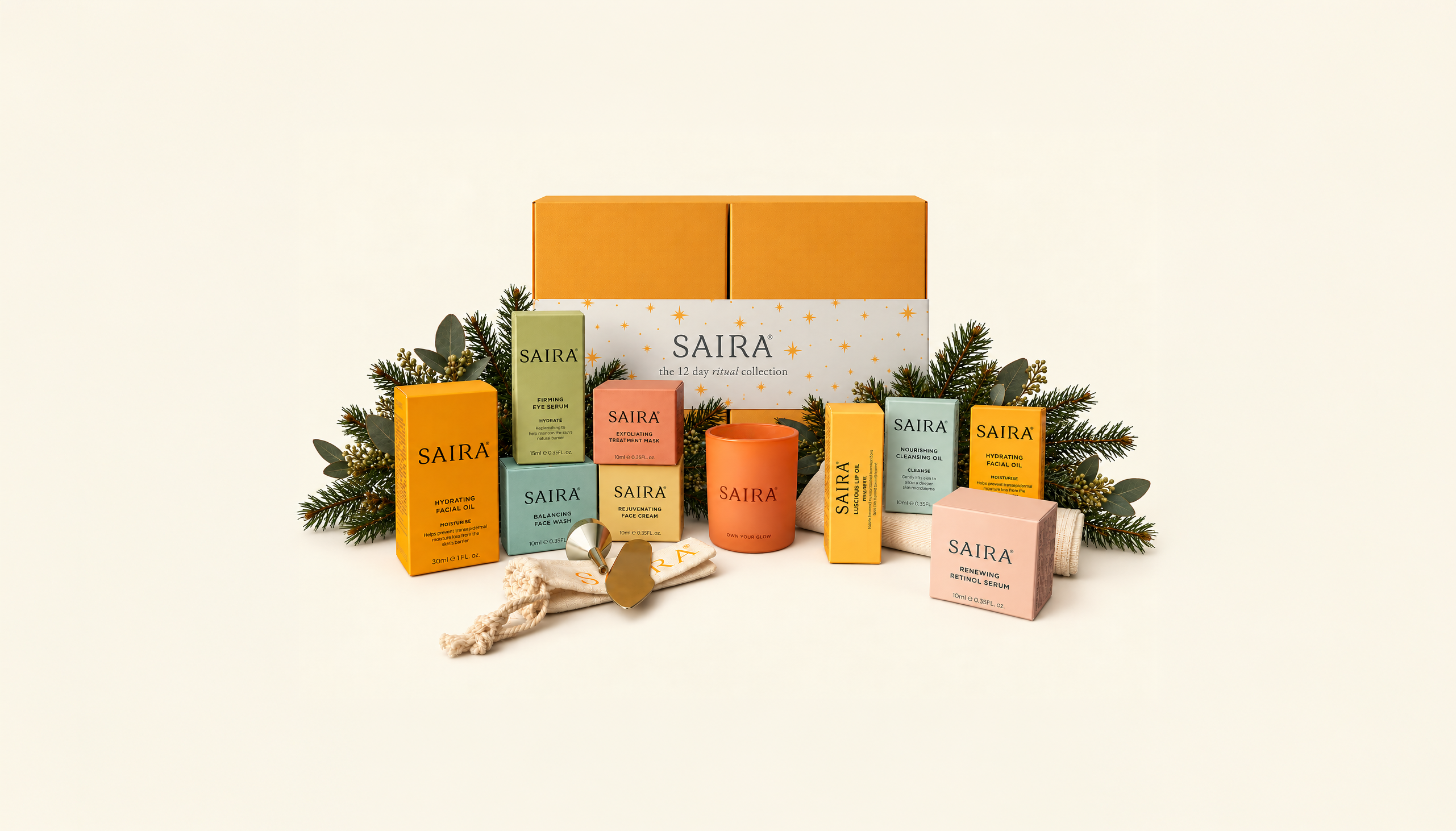 The SAIRA '12 day ritual collection' skincare set arranged with festive greenery on a light background.
