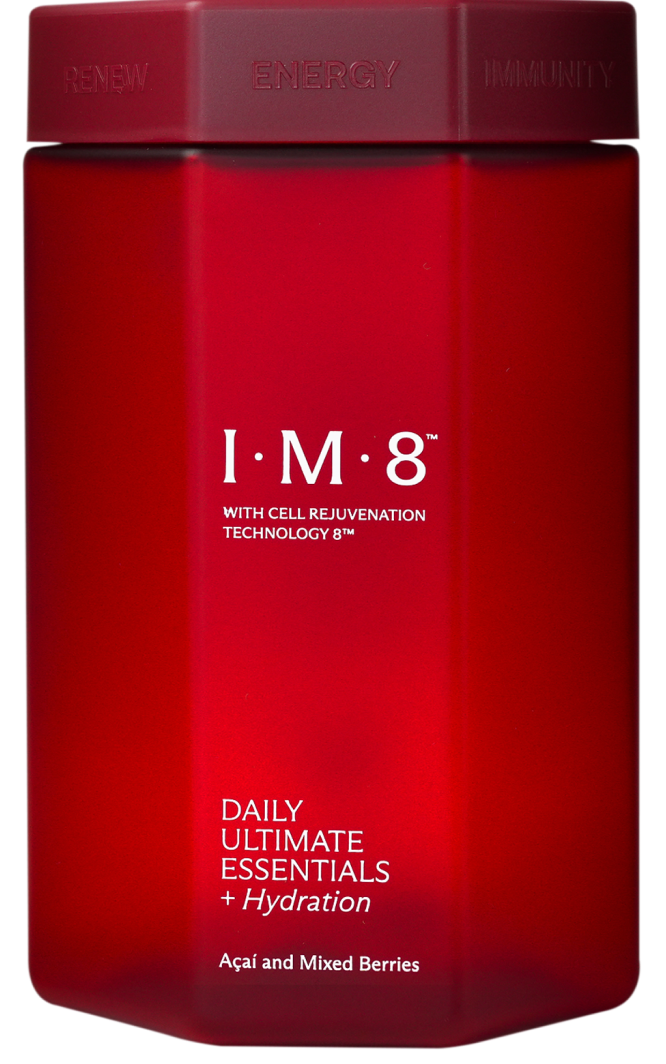 A red, octagonal jar of I·M·8 Daily Ultimate Essentials + Hydration, flavored with açaí and mixed berries.
