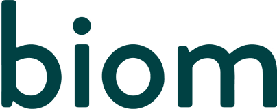 The image shows the word 'biom' in lowercase teal letters.