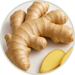 Whole ginger root and sliced pieces on a plate.