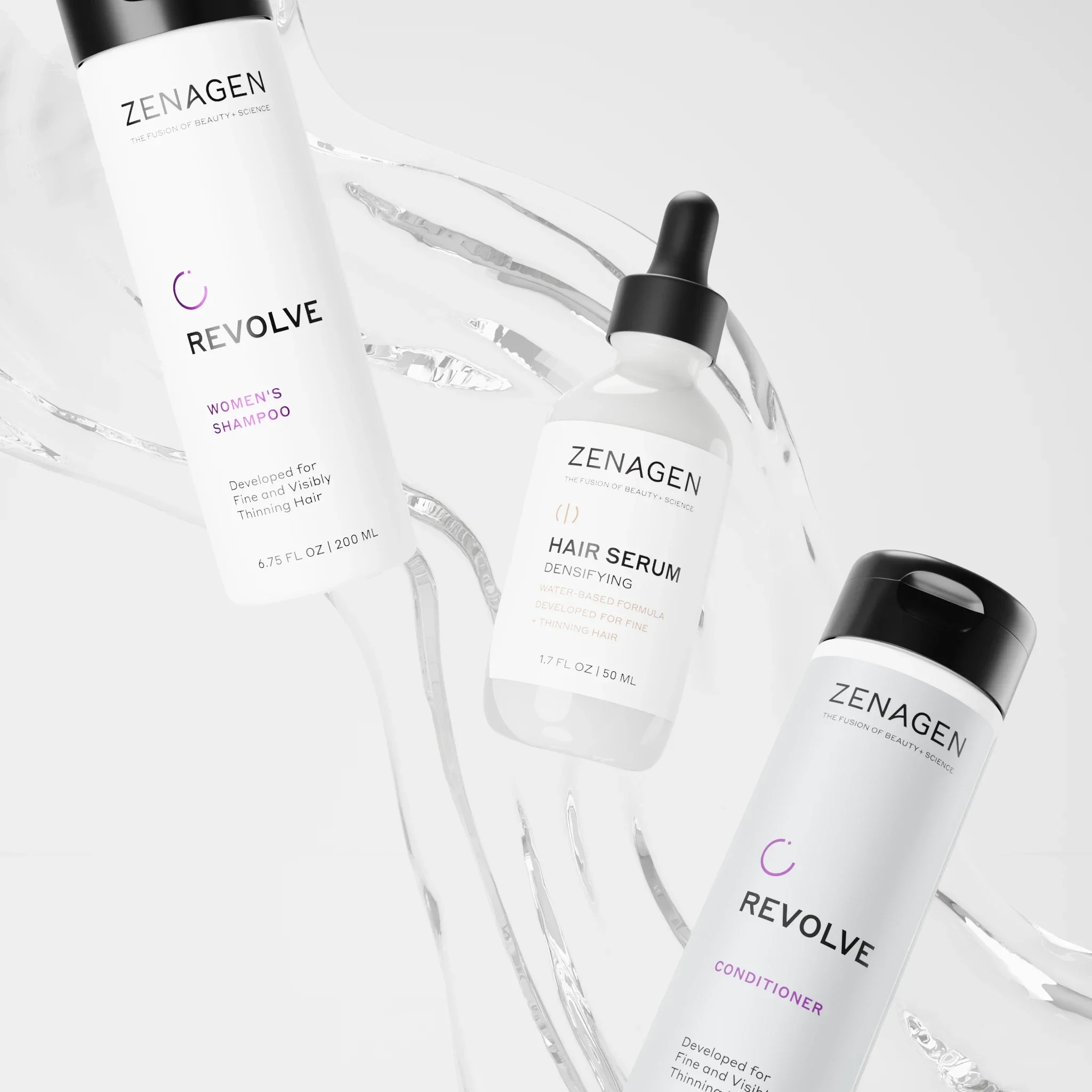 Zenagen women's shampoo, conditioner, and densifying hair serum bottles arranged with clear liquid on a white background.