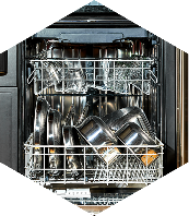 Open dishwasher filled with clean, shiny pots and pans.