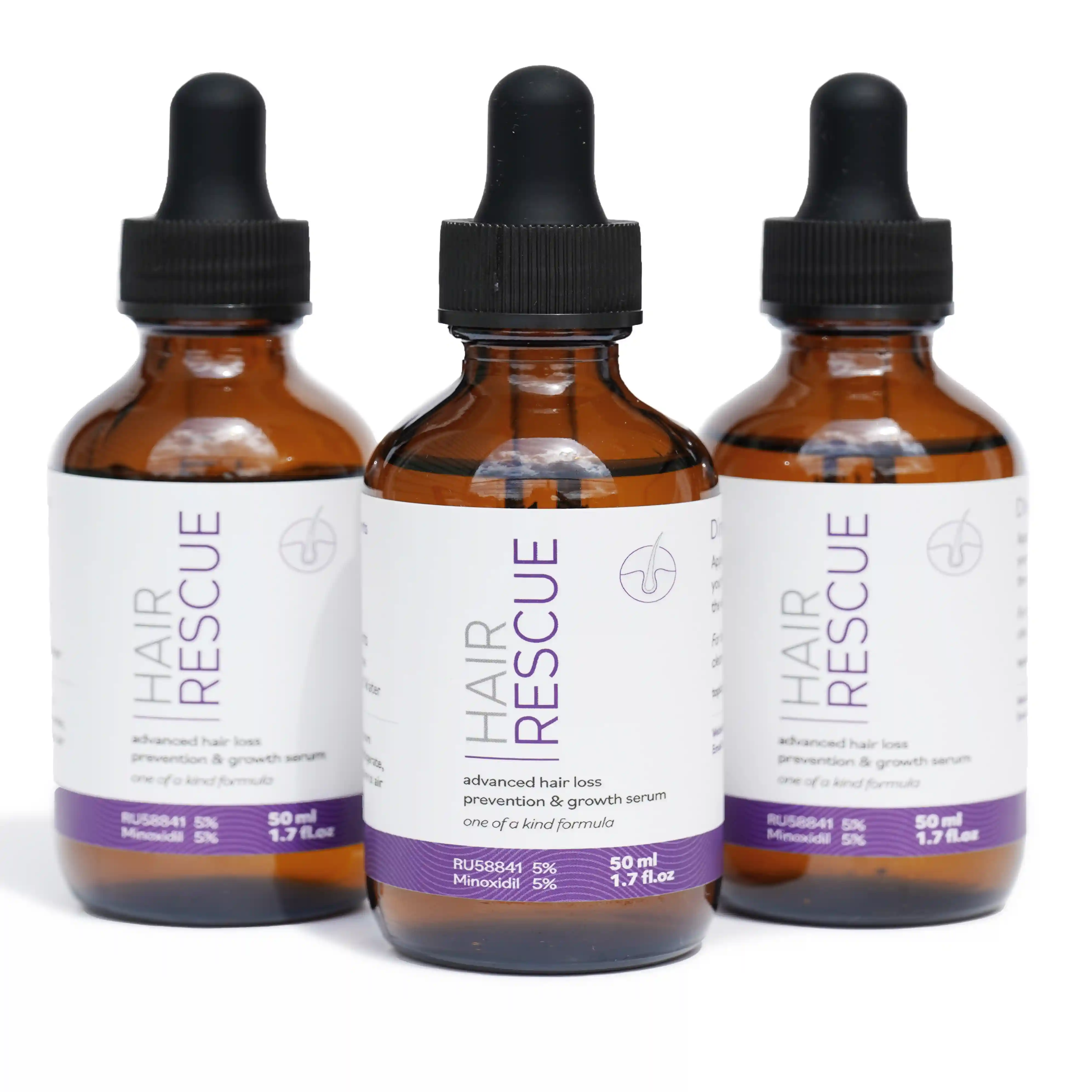 Three bottles of 'Hair Rescue' serum with droppers.