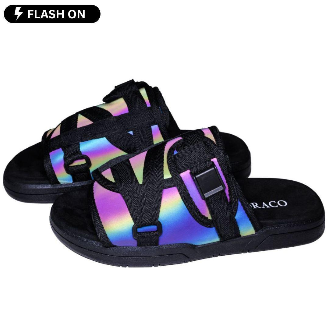 Pair of colorful sandals with black straps and buckles.