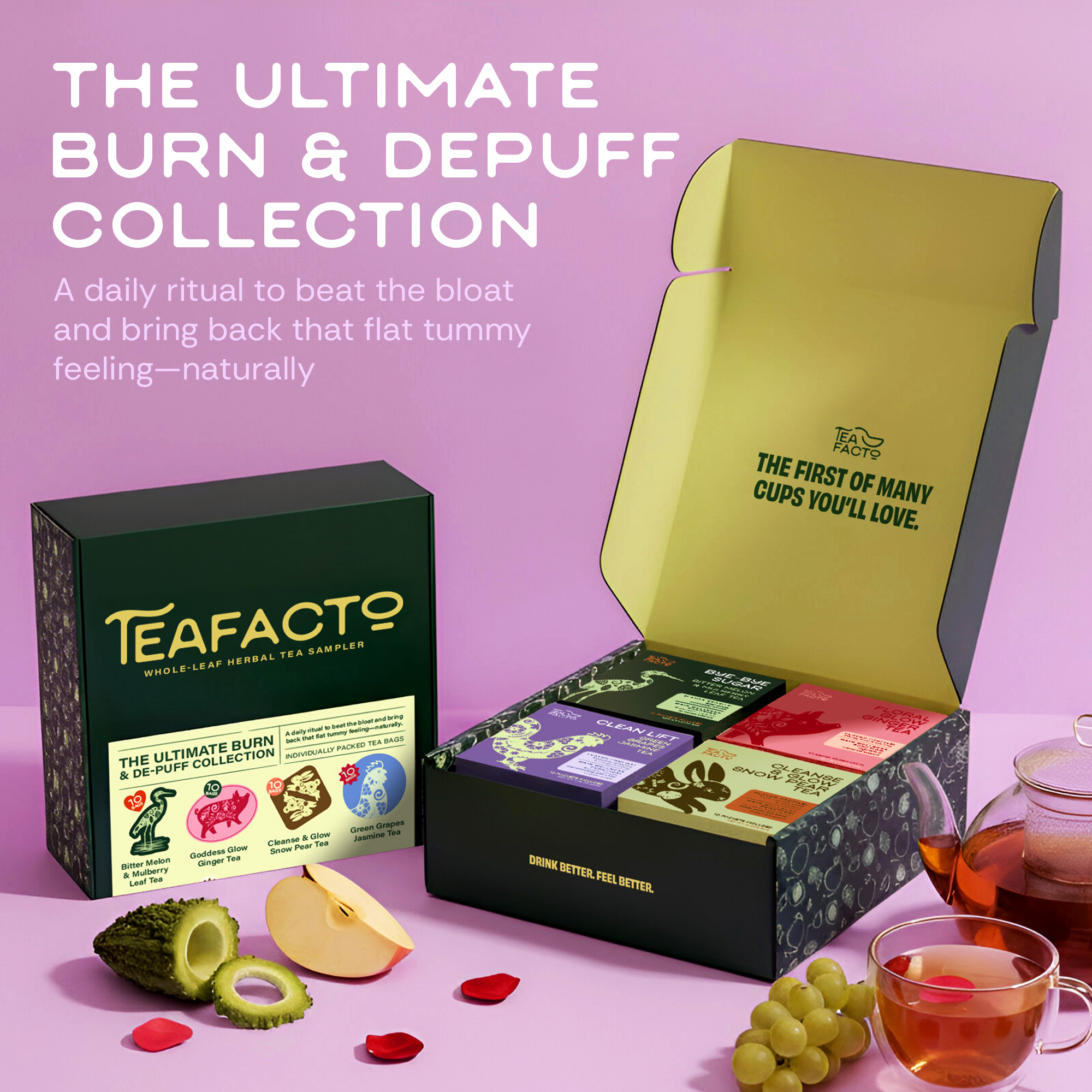 Tea sampler box with colorful tea packages, glass teapot, cup, fruits, and rose petals on a pink background.