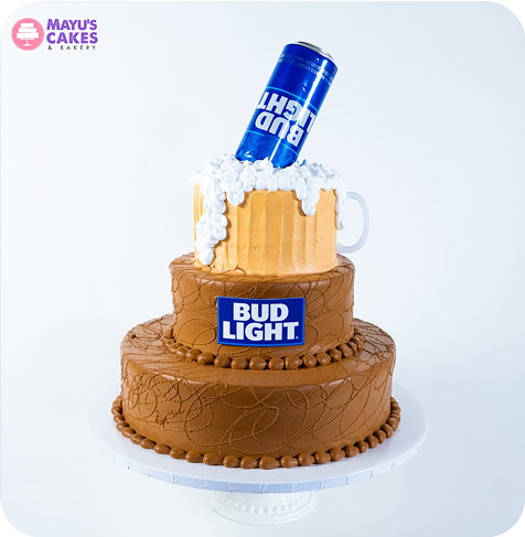 Two-tiered cake with a Bud Light can and beer mug design.