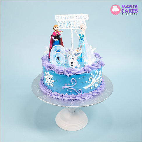 Blue and purple Frozen-themed birthday cake with figurines and snowflake decorations.