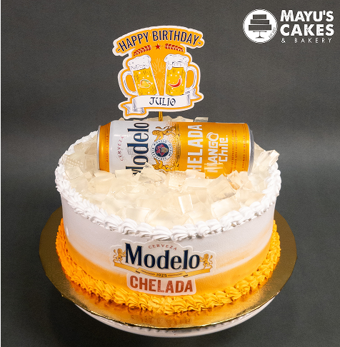 Birthday cake with Modelo Chelada can and 'Happy Birthday Julio' topper.