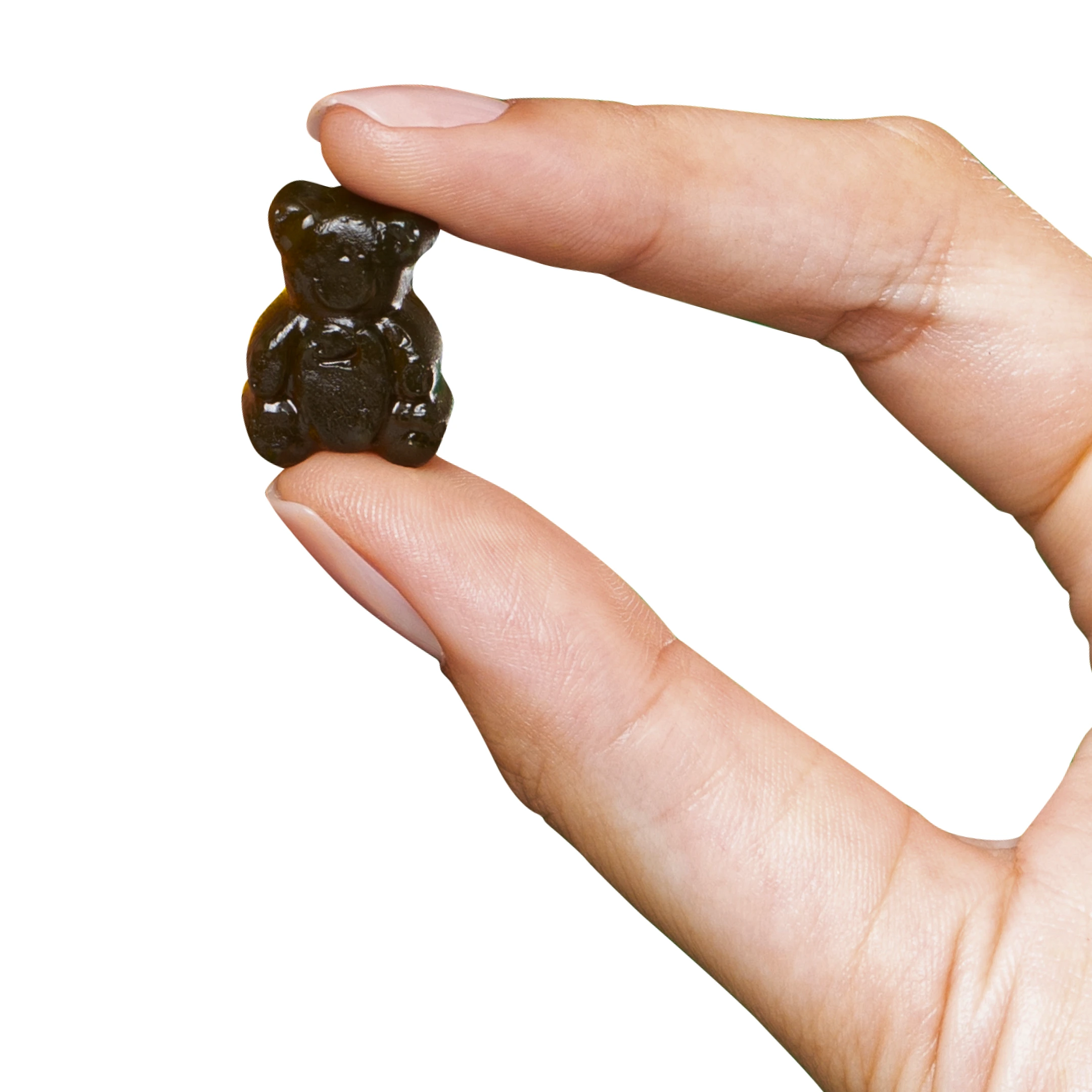Hand holding a small gummy bear candy between fingers.