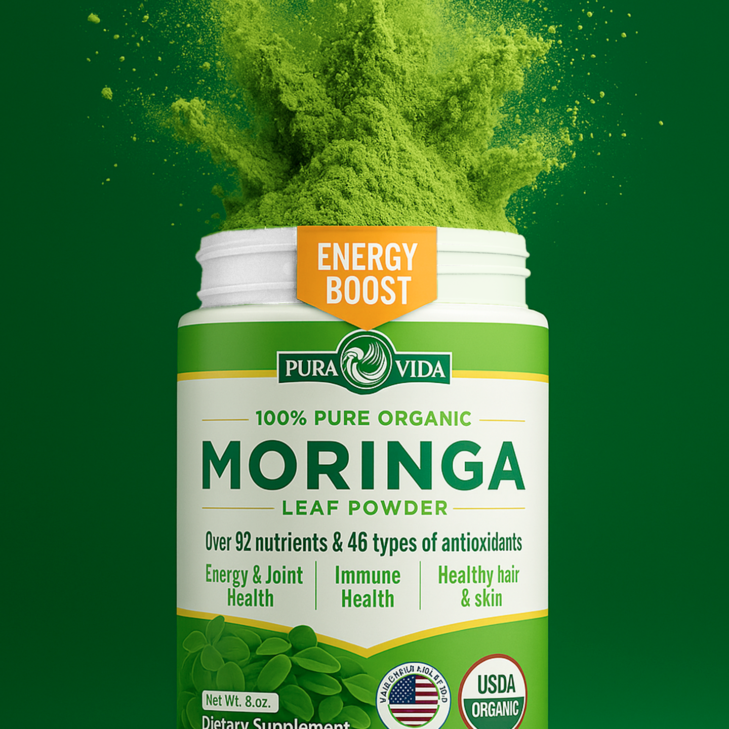 Person smiling, holding a bottle of Moringa capsules, holding up 2 fingers for serving size.