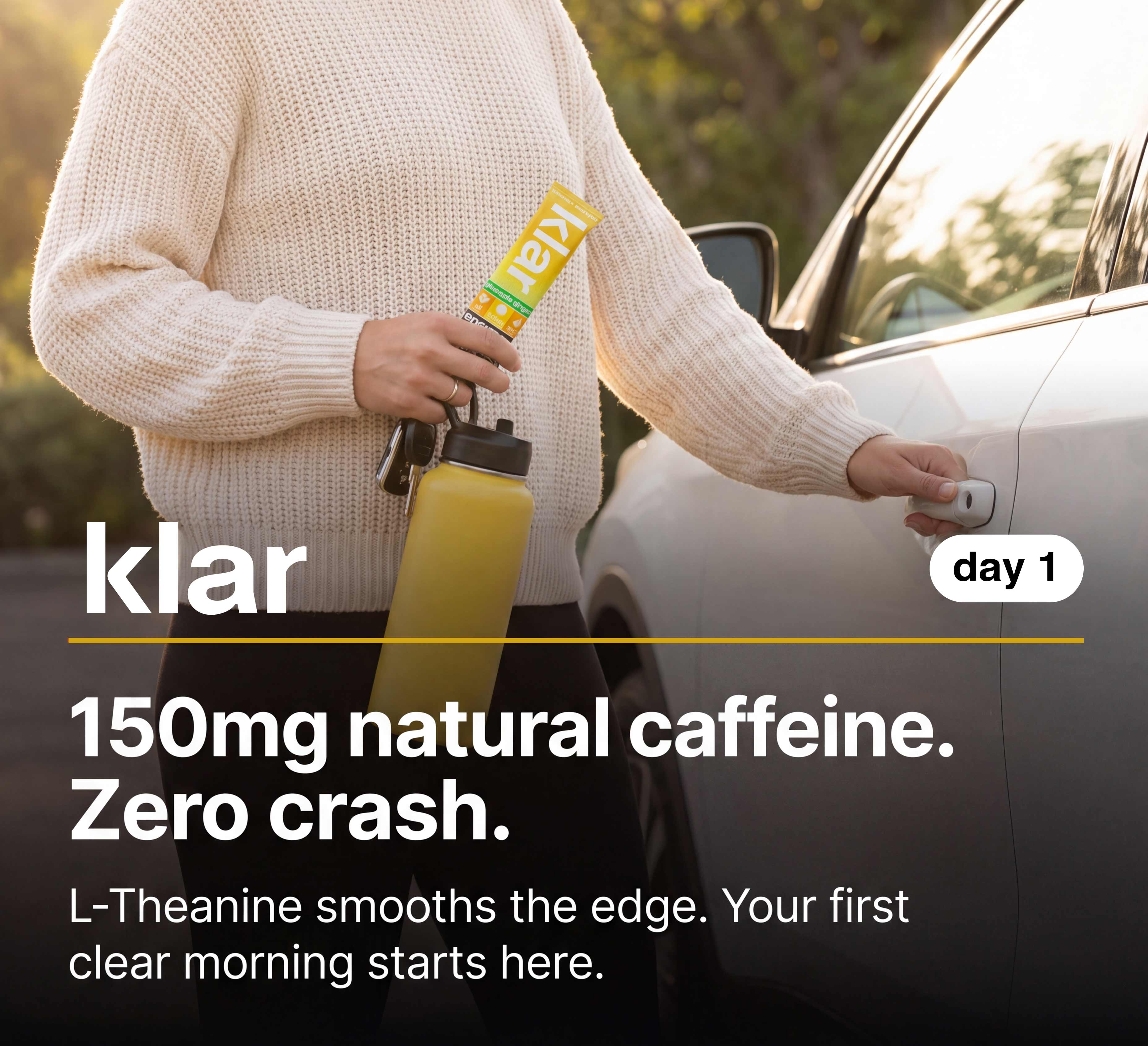 A person in a cream sweater holds a water bottle and a product packet while opening a car door.