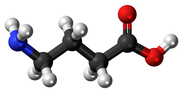 3D molecular model with black, white, red, and blue spheres connected by rods.