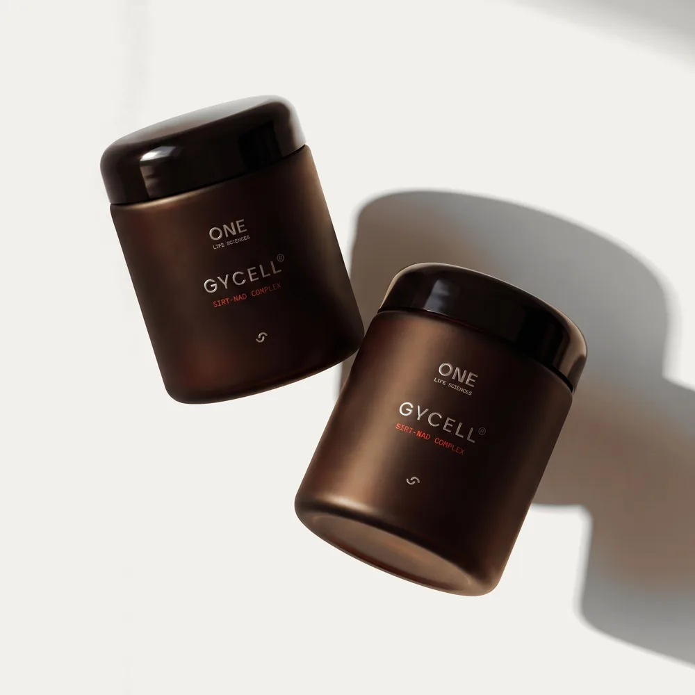 Two brown jars of Gycell SIRT-NAD Complex supplements arranged diagonally on a white background with soft shadows.