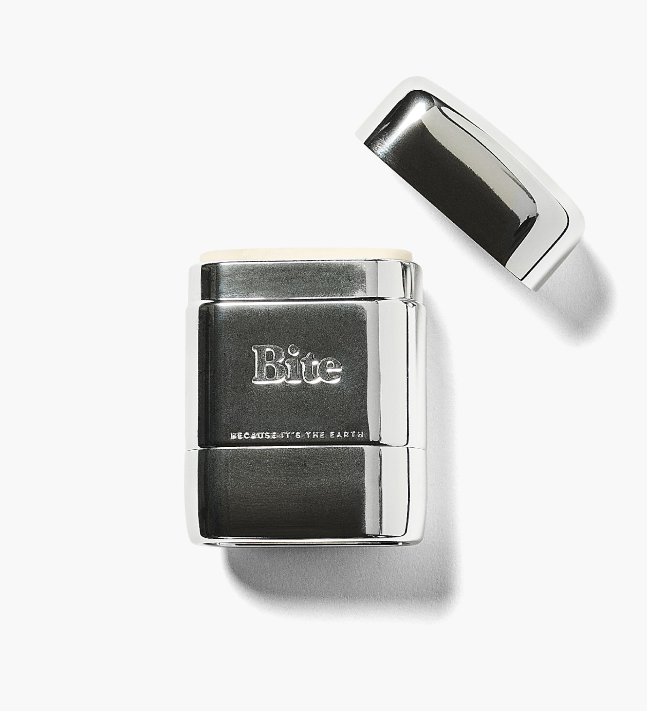 Silver cylindrical container with 'Bite' logo, cap removed, on white background.