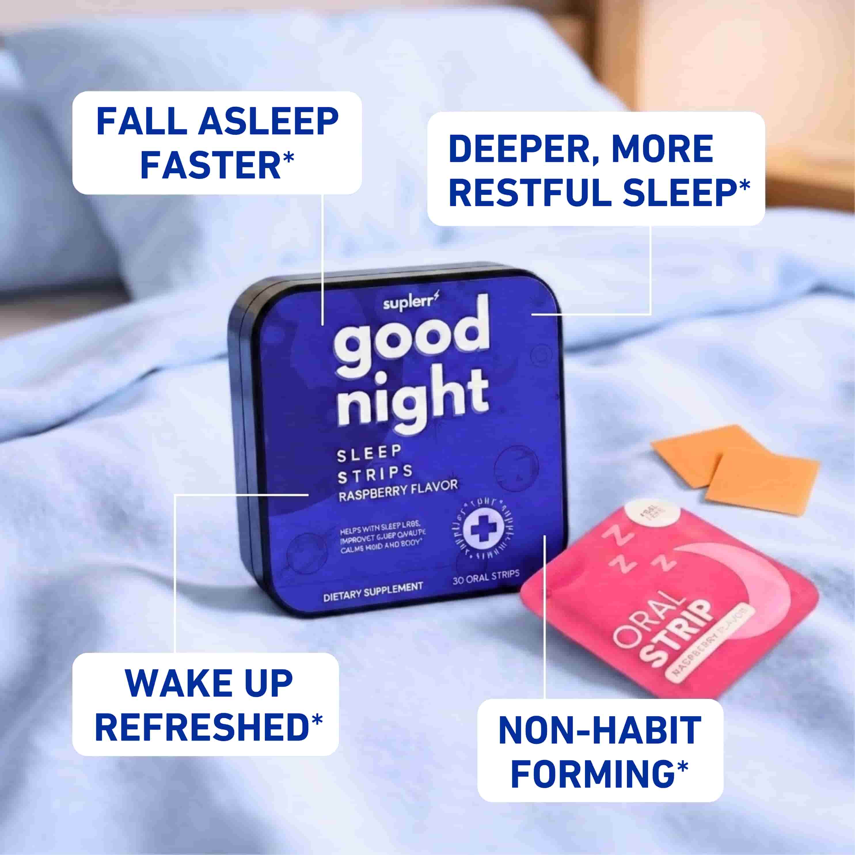 A container of 'Good Night' sleep strips and individual packets resting on a light blue bedsheet.