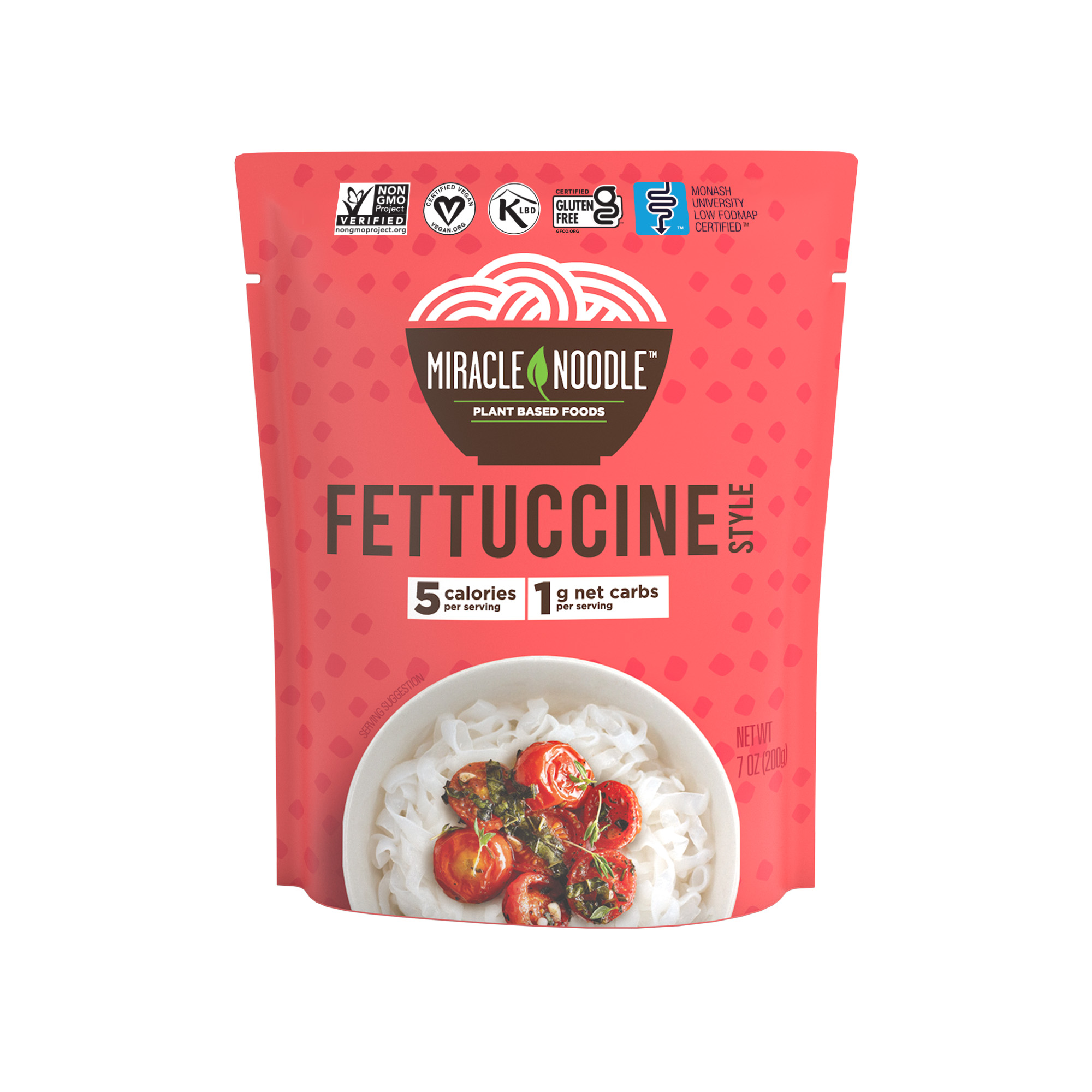 Red package of plant-based fettuccine with a dish of noodles and tomatoes.