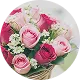 A circular photo of a bouquet of pink and red roses with small white flowers.