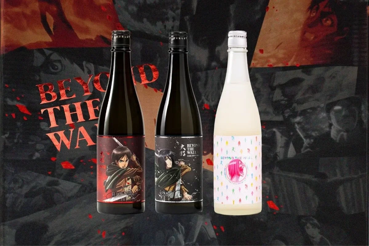 Three bottles of sake with labels featuring characters from the anime Attack on Titan.