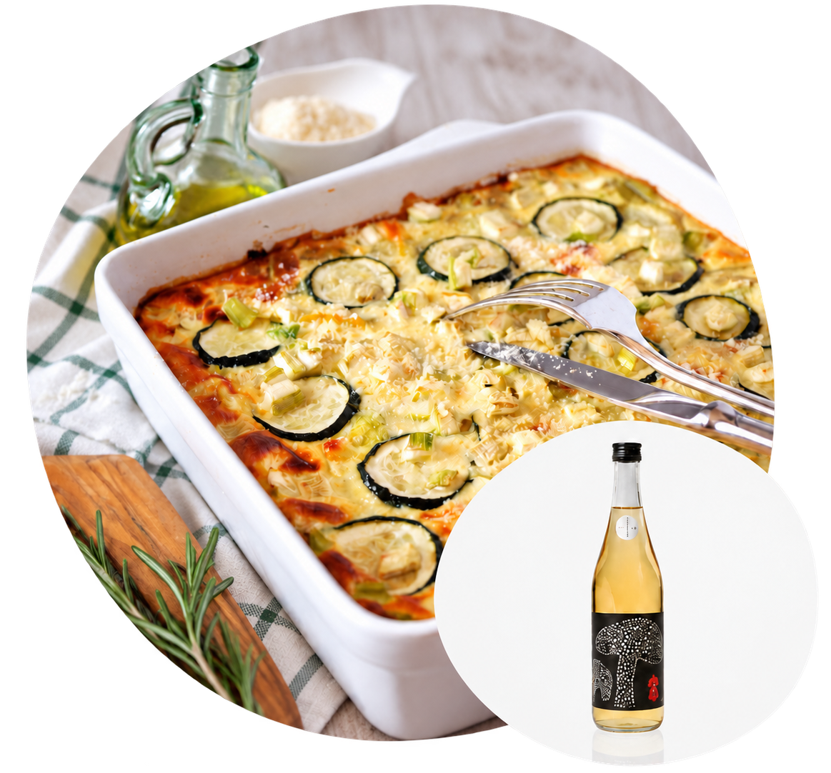 A zucchini gratin in a white baking dish, with an inset image of a bottle of Yano sake.