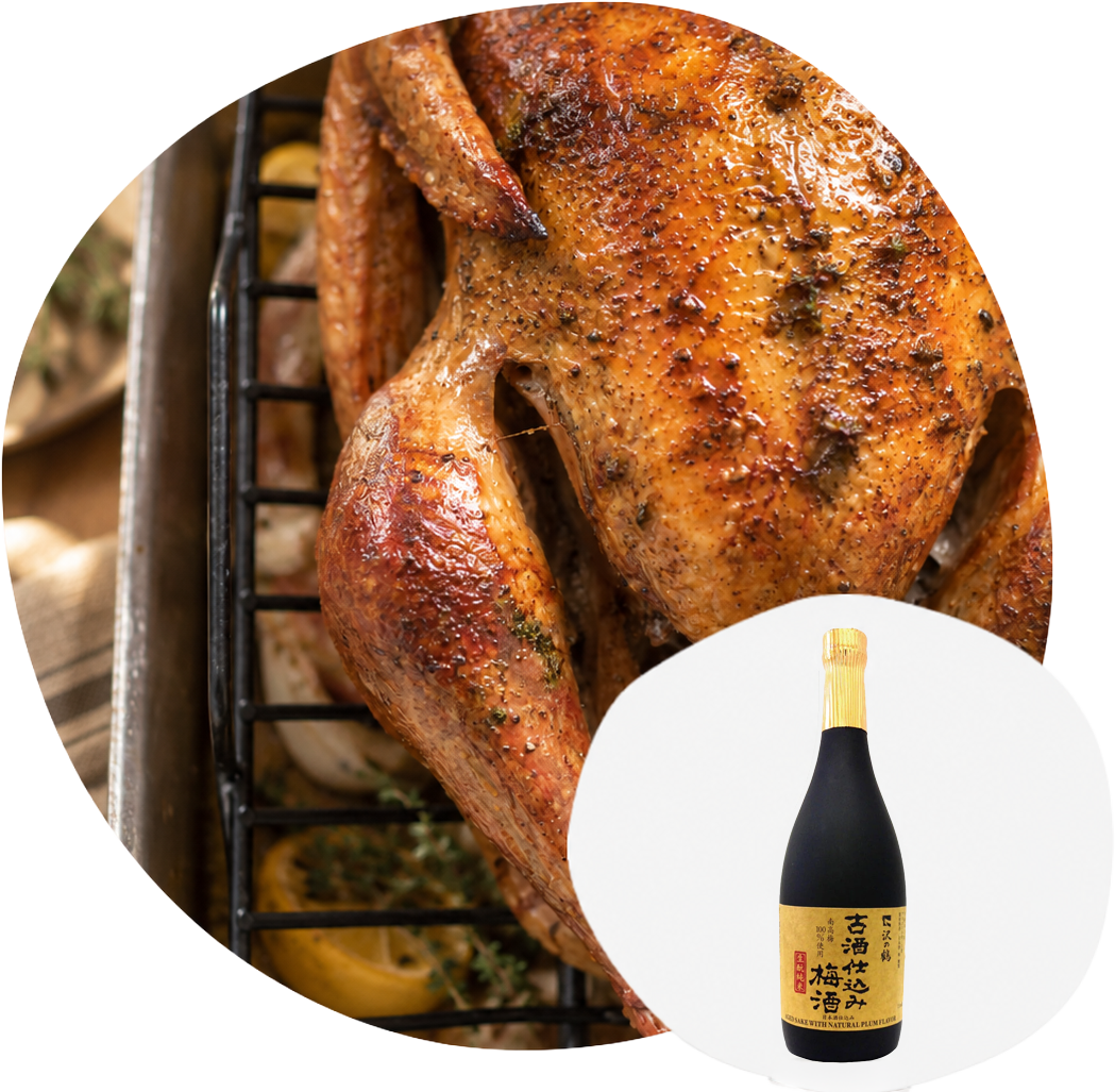 Sliced roast turkey on a platter, with an inset image of a bottle of Sawanotsuru plum sake.