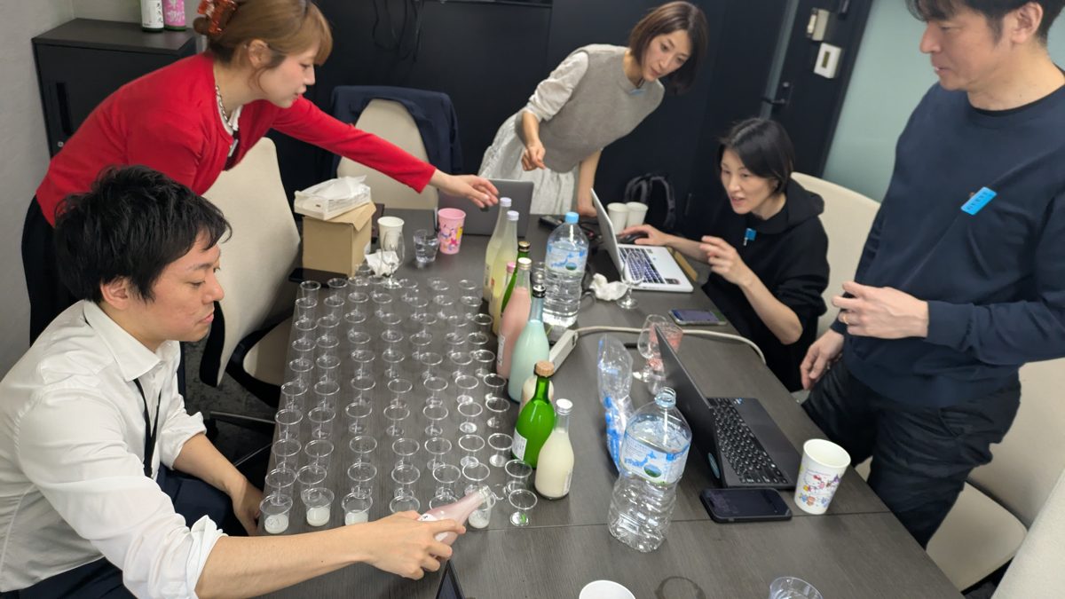 Our sourcing team in Japan tasting a table of sake samples