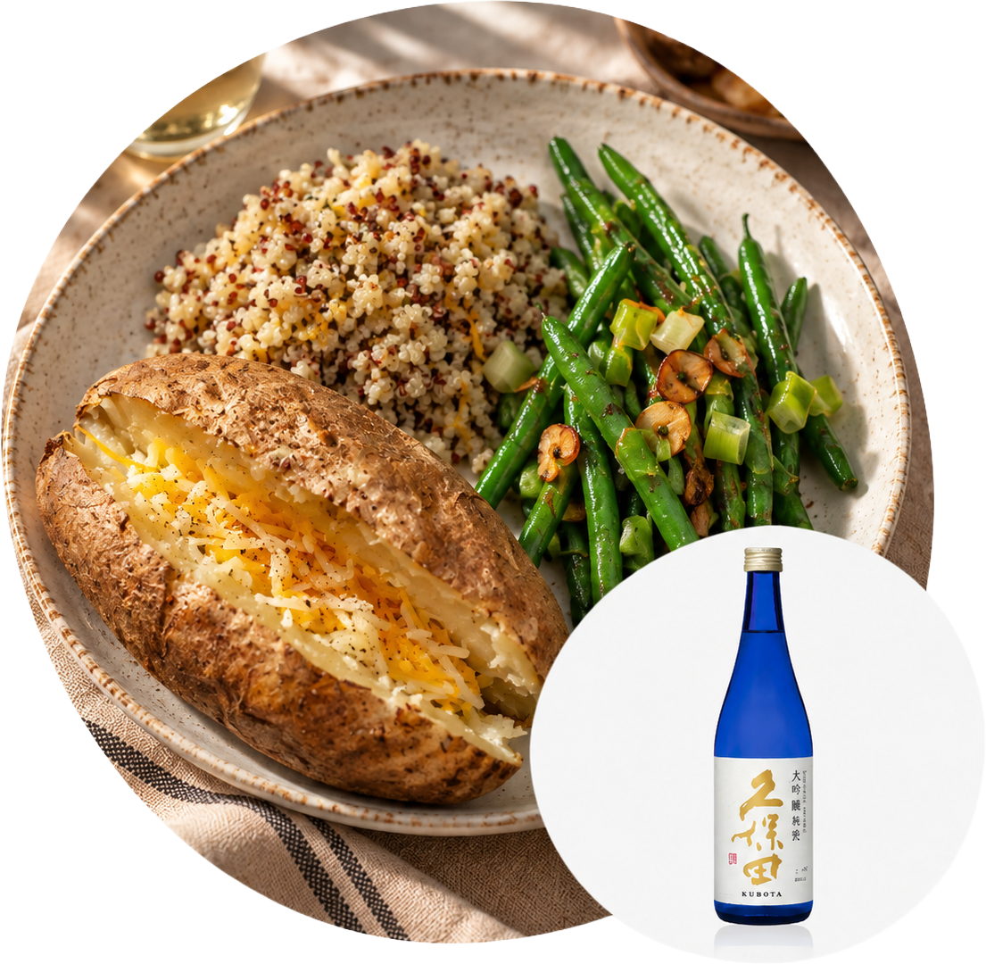 A plated meal of a baked potato, quinoa, and green beans with a bottle of Kubota sake.